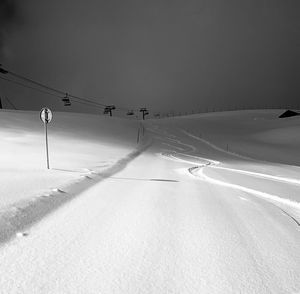 Scenic view of snow covered landscape against sky