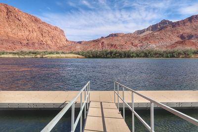 Landscape of small dock and red hills and the colorado river at lees ferry