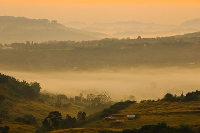 Scenic view of landscape against sky during sunset