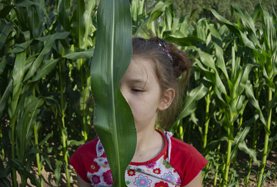 Portrait of girl with plants