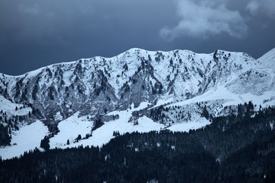 Snow covered mountains against sky