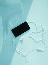 High angle view of smart phone on table