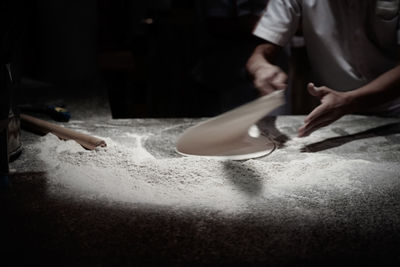 Midsection of man preparing food