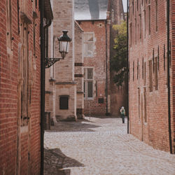 Street amidst flemish buildings