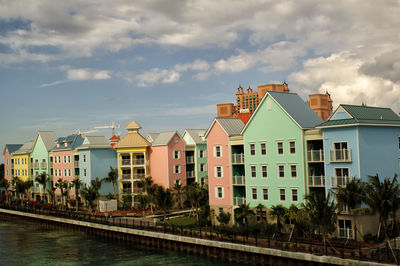 Buildings against cloudy sky