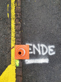 High angle view of arrow sign on road