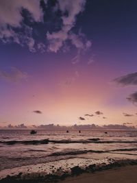 Scenic view of beach against sky during sunset