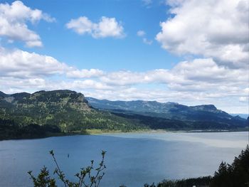 Scenic view of landscape and mountains against sky