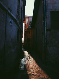 Narrow alley along buildings