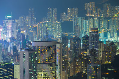 Aerial view of illuminated buildings in city at night