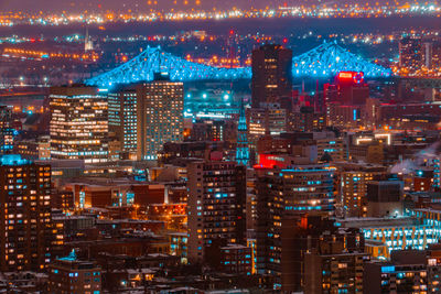 High angle view of illuminated buildings in city at night