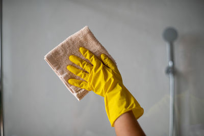 Person holding yellow umbrella