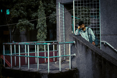 Woman looking at railing