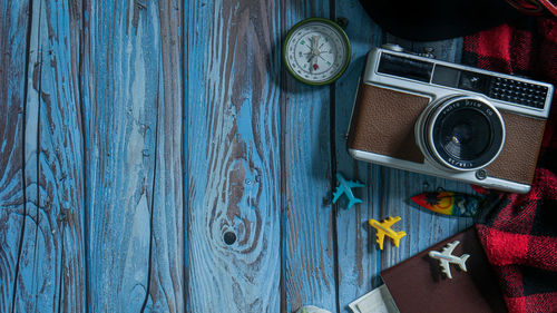 High angle view of old camera on table