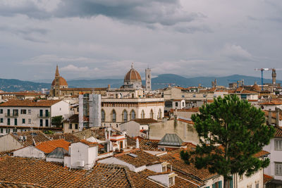 View of buildings in town against sky