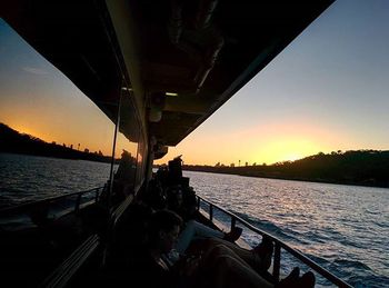 Bridge over river at sunset