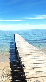 Pier on sea against sky