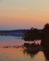 Scenic view of lake at sunset