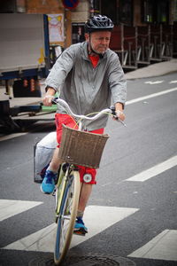 Man riding bicycle on road