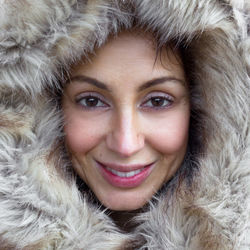 Close-up portrait of a smiling woman in winter