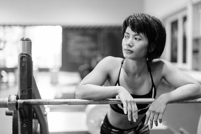 Young woman looking away at gym