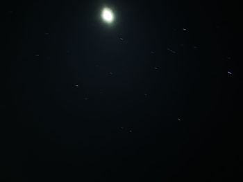 Low angle view of moon in sky at night