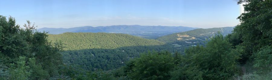 Scenic view of landscape and mountains against sky