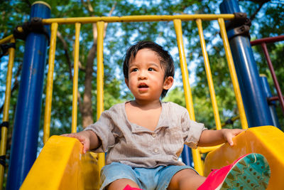 Cute boy playing in playground