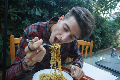 Portrait of man eating food