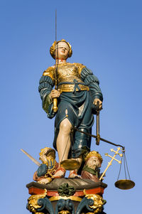 Low angle view of statue against clear sky