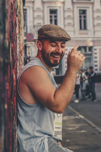 Portrait of young man in city