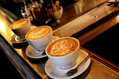 Close-up of cappuccino served on table