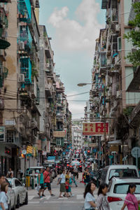 People on road in city