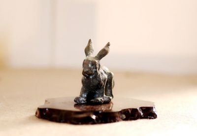 Close-up of statue on table