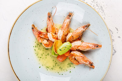 High angle view of prawns in plate on table