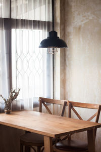 Empty table and chairs at home