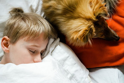 High angle view of cute boy sleeping