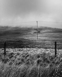 Scenic view of landscape against cloudy sky