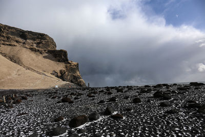 Rock formation on land against sky