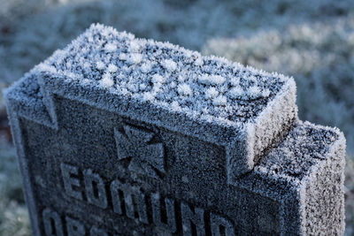 Close-up of snow on cemetery