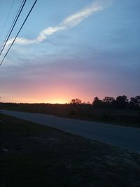 Scenic view of landscape against sky at sunset