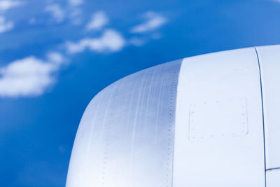 Low angle view of airplane flying against sky