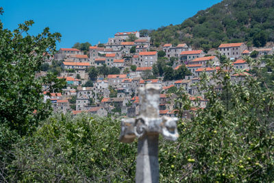 High angle view of trees and buildings against sky