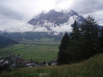 Scenic view of landscape against cloudy sky