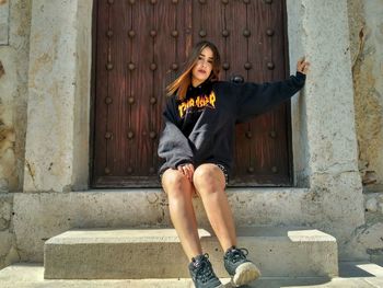 Portrait of a smiling woman sitting outdoors