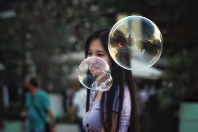 Reflection of man in bubbles