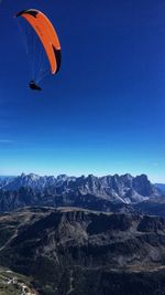 Scenic view of mountains against blue sky