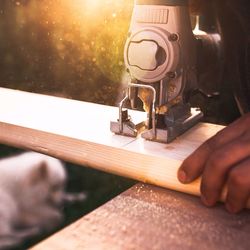 Cropped image of carpenter working in workshop