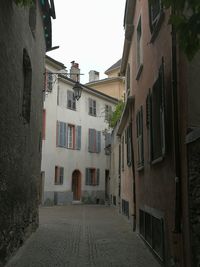 Narrow street amidst buildings in town