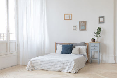 Interior of white and gray cozy bedroom